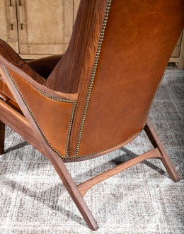 modern rustic leather chair with exposed wood arms