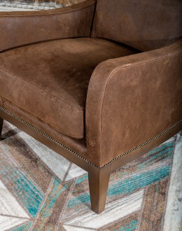Bronco Blaze Leather Chair Bronco Blaze Leather Chair in distressed chocolate brown, showcasing arched wings, bustle back design, and American-made craftsmanship.