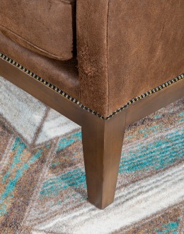 Bronco Blaze Leather Chair Bronco Blaze Leather Chair in distressed chocolate brown, showcasing arched wings, bustle back design, and American-made craftsmanship.