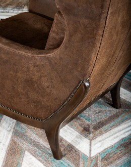 Bronco Blaze Leather Chair Bronco Blaze Leather Chair in distressed chocolate brown, showcasing arched wings, bustle back design, and American-made craftsmanship.