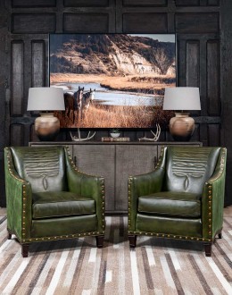 distressed olive color leather chair with boot stitch emblem on seat back