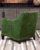 distressed olive color leather chair with boot stitch emblem on seat back