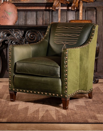 distressed olive color leather chair with boot stitch emblem on seat back