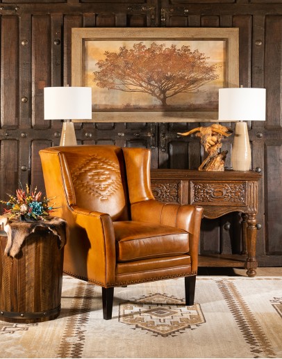 Cheyenne Leather Chair distressed brown leather chair with native American inspired stitch emblem on seat back