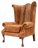 distressed tan leather wingback chair with genuine axis deer skin
