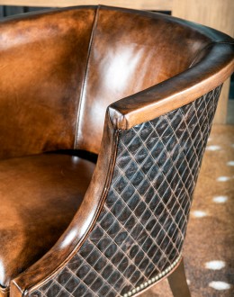 Diamondback Leather Chair in modern rustic style, featuring full-grain, hand-burnished leather and diamond-stitched top-grain leather accents, made with 8-way hand-tied construction, perfect for bedroom, office, or living area.