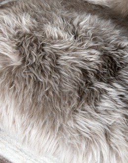 Kodiak Arm Chair American-made Kodiak Arm Chair with solid black walnut frame, crocodile-pattern stamped leather arms, and luxurious Angora hair cushions, accented by nickel nail heads.