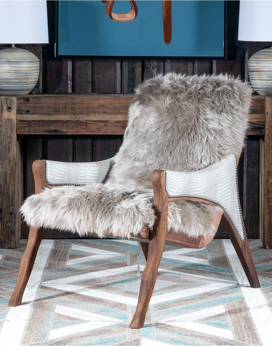 Kodiak Arm Chair American-made Kodiak Arm Chair with solid black walnut frame, crocodile-pattern stamped leather arms, and luxurious Angora hair cushions, accented by nickel nail heads.