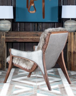 Kodiak Arm Chair American-made Kodiak Arm Chair with solid black walnut frame, crocodile-pattern stamped leather arms, and luxurious Angora hair cushions, accented by nickel nail heads.