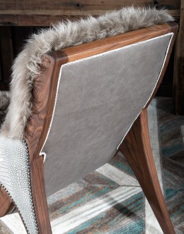 Kodiak Arm Chair American-made Kodiak Arm Chair with solid black walnut frame, crocodile-pattern stamped leather arms, and luxurious Angora hair cushions, accented by nickel nail heads.