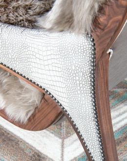 Kodiak Arm Chair American-made Kodiak Arm Chair with solid black walnut frame, crocodile-pattern stamped leather arms, and luxurious Angora hair cushions, accented by nickel nail heads.