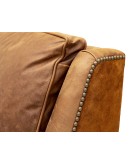 small distressed brown leather chair with suede leather accents 