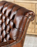 Elegant Tufted Leather Chair with deep button tufting, brass nail accents, and hand-burnished full-grain leather.