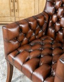 Elegant Tufted Leather Chair with deep button tufting, brass nail accents, and hand-burnished full-grain leather.