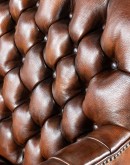 Elegant Tufted Leather Chair with deep button tufting, brass nail accents, and hand-burnished full-grain leather.