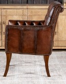 Elegant Tufted Leather Chair with deep button tufting, brass nail accents, and hand-burnished full-grain leather.