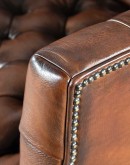 Elegant Tufted Leather Chair with deep button tufting, brass nail accents, and hand-burnished full-grain leather.