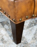 saddle tan distressed leather lounge chair