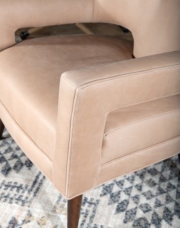 Rhodes Leather Chair in cream top grain leather with a low-profile, modern rustic design, showcasing American craftsmanship.