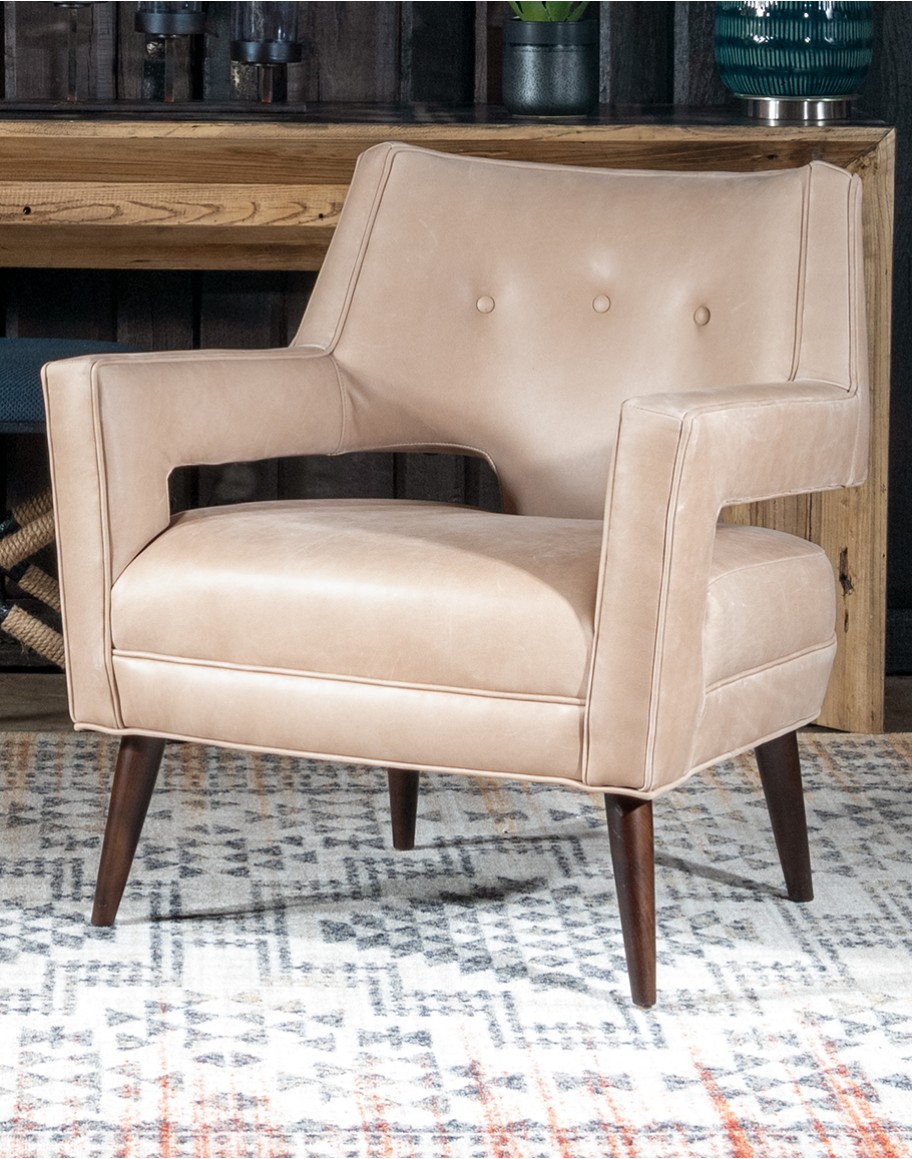 Rhodes Leather Chair in cream top grain leather with a low-profile, modern rustic design, showcasing American craftsmanship.