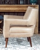 Rhodes Leather Chair in cream top grain leather with a low-profile, modern rustic design, showcasing American craftsmanship.