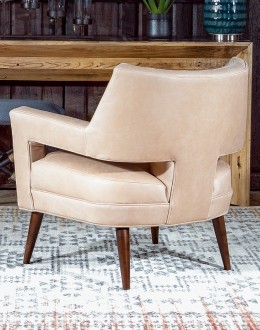 Rhodes Leather Chair in cream top grain leather with a low-profile, modern rustic design, showcasing American craftsmanship.