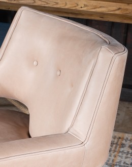 Rhodes Leather Chair in cream top grain leather with a low-profile, modern rustic design, showcasing American craftsmanship.