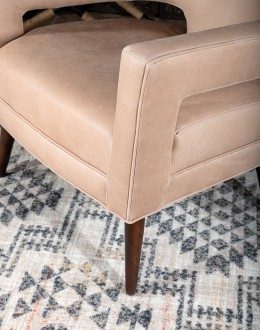 Rhodes Leather Chair in cream top grain leather with a low-profile, modern rustic design, showcasing American craftsmanship.