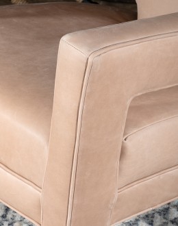 Rhodes Leather Chair in cream top grain leather with a low-profile, modern rustic design, showcasing American craftsmanship.