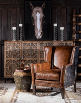 Weston Leather Chair Experience ultimate comfort and luxury with the Weston Leather Chair. This premium wingback chair features a tight back, full grain leather with hand burnished details, and brindle cowhide wrapping along the sides and back. Handcrafted in America with 8-w