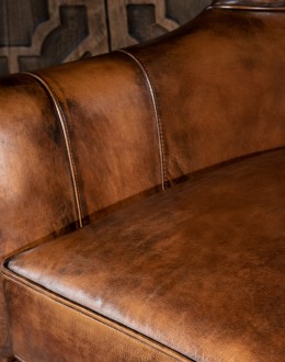 Weston Leather Chair Experience ultimate comfort and luxury with the Weston Leather Chair. This premium wingback chair features a tight back, full grain leather with hand burnished details, and brindle cowhide wrapping along the sides and back. Handcrafted in America with 8-w