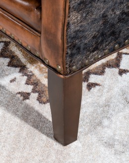 Weston Leather Chair Experience ultimate comfort and luxury with the Weston Leather Chair. This premium wingback chair features a tight back, full grain leather with hand burnished details, and brindle cowhide wrapping along the sides and back. Handcrafted in America with 8-w