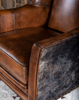Weston Leather Chair Experience ultimate comfort and luxury with the Weston Leather Chair. This premium wingback chair features a tight back, full grain leather with hand burnished details, and brindle cowhide wrapping along the sides and back. Handcrafted in America with 8-w