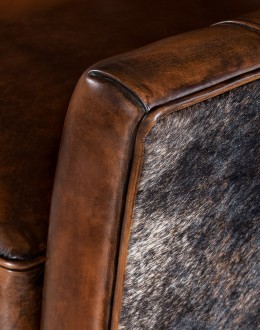 Weston Leather Chair Experience ultimate comfort and luxury with the Weston Leather Chair. This premium wingback chair features a tight back, full grain leather with hand burnished details, and brindle cowhide wrapping along the sides and back. Handcrafted in America with 8-w