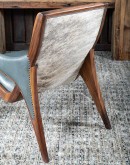 Yachtsman’s Sky Leather Chair with grey-blue leather, black walnut frame, and brindle cowhide back, accented with nickel nail heads.