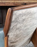 Yachtsman’s Sky Leather Chair with grey-blue leather, black walnut frame, and brindle cowhide back, accented with nickel nail heads.