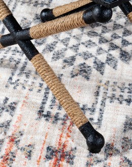Cobalt Foot Stool featuring a rustic iron frame interwoven with natural fiber rope accents for a nautical touch, and a plush, textured navy blue cotton blend cushion.