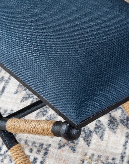 Cobalt Foot Stool featuring a rustic iron frame interwoven with natural fiber rope accents for a nautical touch, and a plush, textured navy blue cotton blend cushion.
