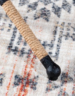 Cobalt Foot Stool featuring a rustic iron frame interwoven with natural fiber rope accents for a nautical touch, and a plush, textured navy blue cotton blend cushion.