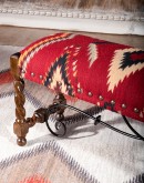 small bench with kilim rug on top
