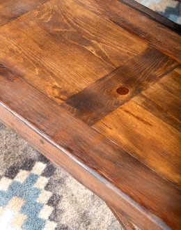 Rustic Pioneer Wagon Wheel Bench made of hand-forged iron and wire-wheeled Chilean Pine, comfortably seating three people, with a distinctive wagon wheel design integrated into the middle