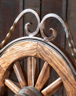 Rustic Pioneer Wagon Wheel Bench made of hand-forged iron and wire-wheeled Chilean Pine, comfortably seating three people, with a distinctive wagon wheel design integrated into the middle