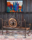 Rustic Pioneer Wagon Wheel Bench made of hand-forged iron and wire-wheeled Chilean Pine, comfortably seating three people, with a distinctive wagon wheel design integrated into the middle