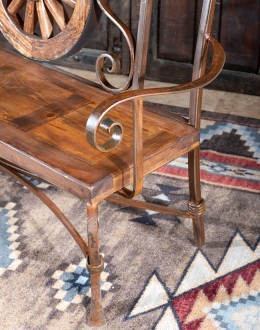 Rustic Pioneer Wagon Wheel Bench made of hand-forged iron and wire-wheeled Chilean Pine, comfortably seating three people, with a distinctive wagon wheel design integrated into the middle