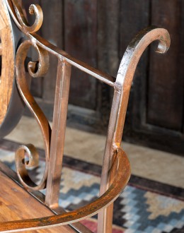 Rustic Pioneer Wagon Wheel Bench made of hand-forged iron and wire-wheeled Chilean Pine, comfortably seating three people, with a distinctive wagon wheel design integrated into the middle