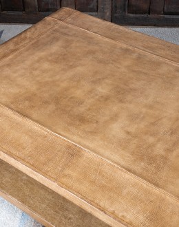 Modern rustic Sonora Sand Leather Coffee Table  featuring a rectangular shape with waterfall edge design, wrapped in fun grain saddle leather in palomino color. Includes a lower open shelf for storage or decoration.