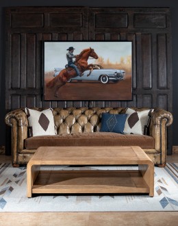 Modern rustic Sonora Sand Leather Coffee Table  featuring a rectangular shape with waterfall edge design, wrapped in fun grain saddle leather in palomino color. Includes a lower open shelf for storage or decoration.