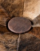42 inch round ottoman with distressed brown leather and brindle cowhide on top
