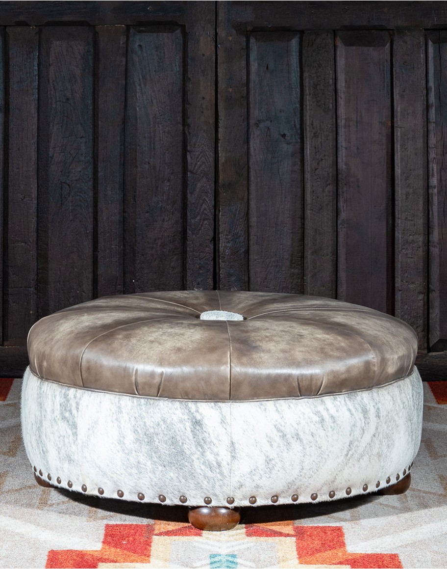 36 inch round ottoman with grey leather top and grey brindle cowhide on the base
