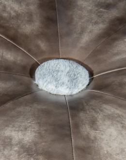 36 inch round ottoman with grey leather top and grey brindle cowhide on the base